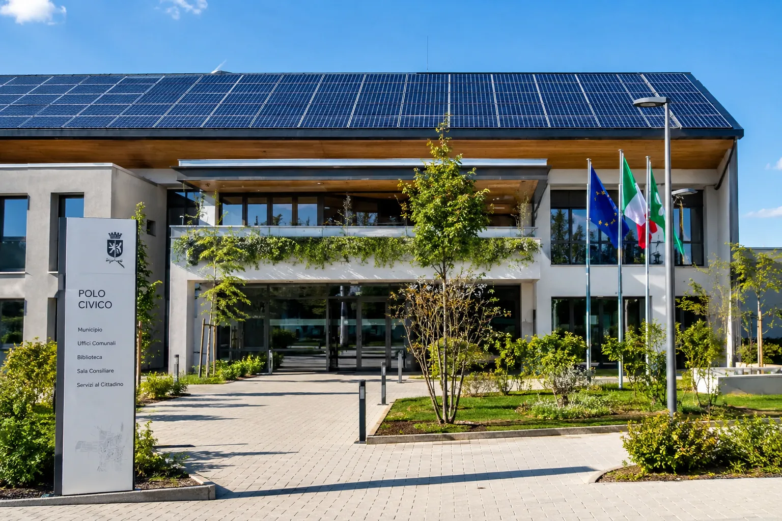 E-360 Suite | Comunità Energetiche nei Comuni: la Pubblica Amministrazione come motore della transizione Edificio pubblico moderno con tetto fotovoltaico, rappresentazione dell'impegno del Comune per le Comunità Energetiche